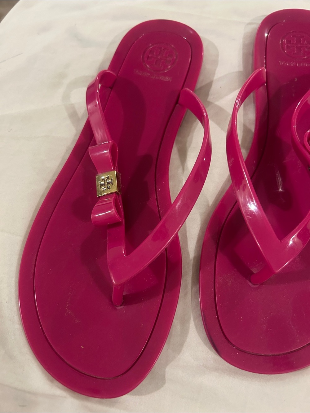 Tory Burch Pink Jelly Bow Flip Flops with Gold Logo